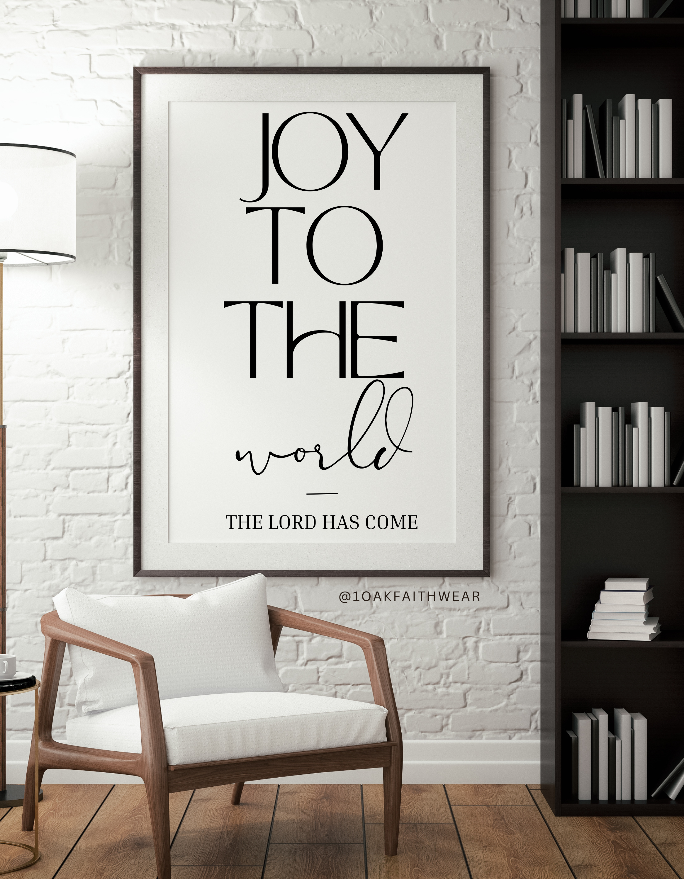 Framed poster with 'Joy to the world' text in a room with a chair and bookshelf.